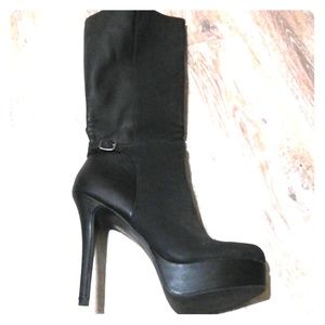 Knee high, black boots.